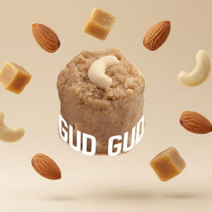 Adadiya with 'GUD GUD' branding surrounded by almonds and cashews on a beige background