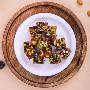 Buy Khajur Chikki online or get Khajur chikki delivery India, featuring the best Khajur dry fruit chikki online from Surat.